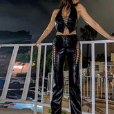 Vaqueros de tiro bajo con cordones y ojales